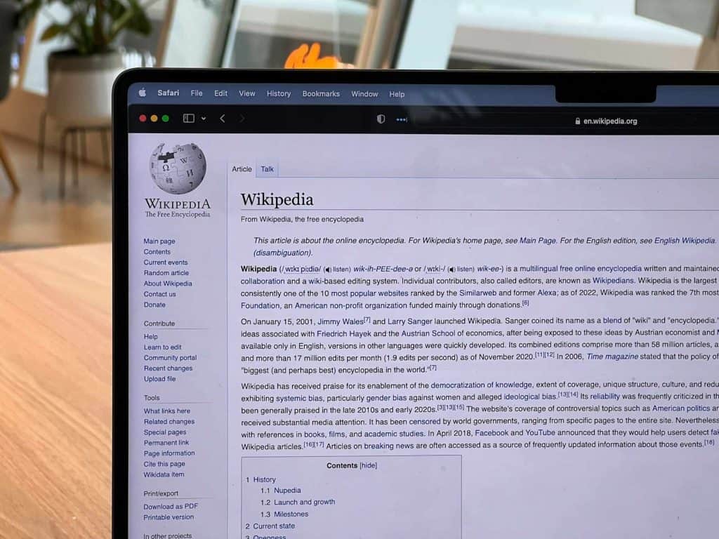 Laptop screen open to the Wikipedia homepage
